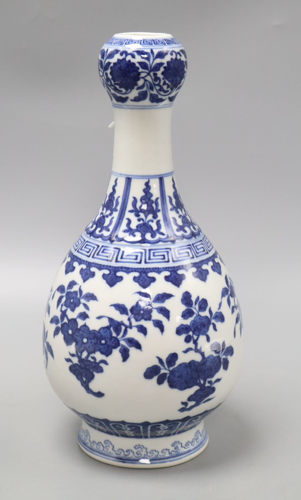 A Chinese blue and white garlic neck vase, Qianlong seal mark but later, drilled hole through mark, height 29.5cm